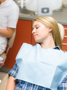 Young woman resting from dental sedation